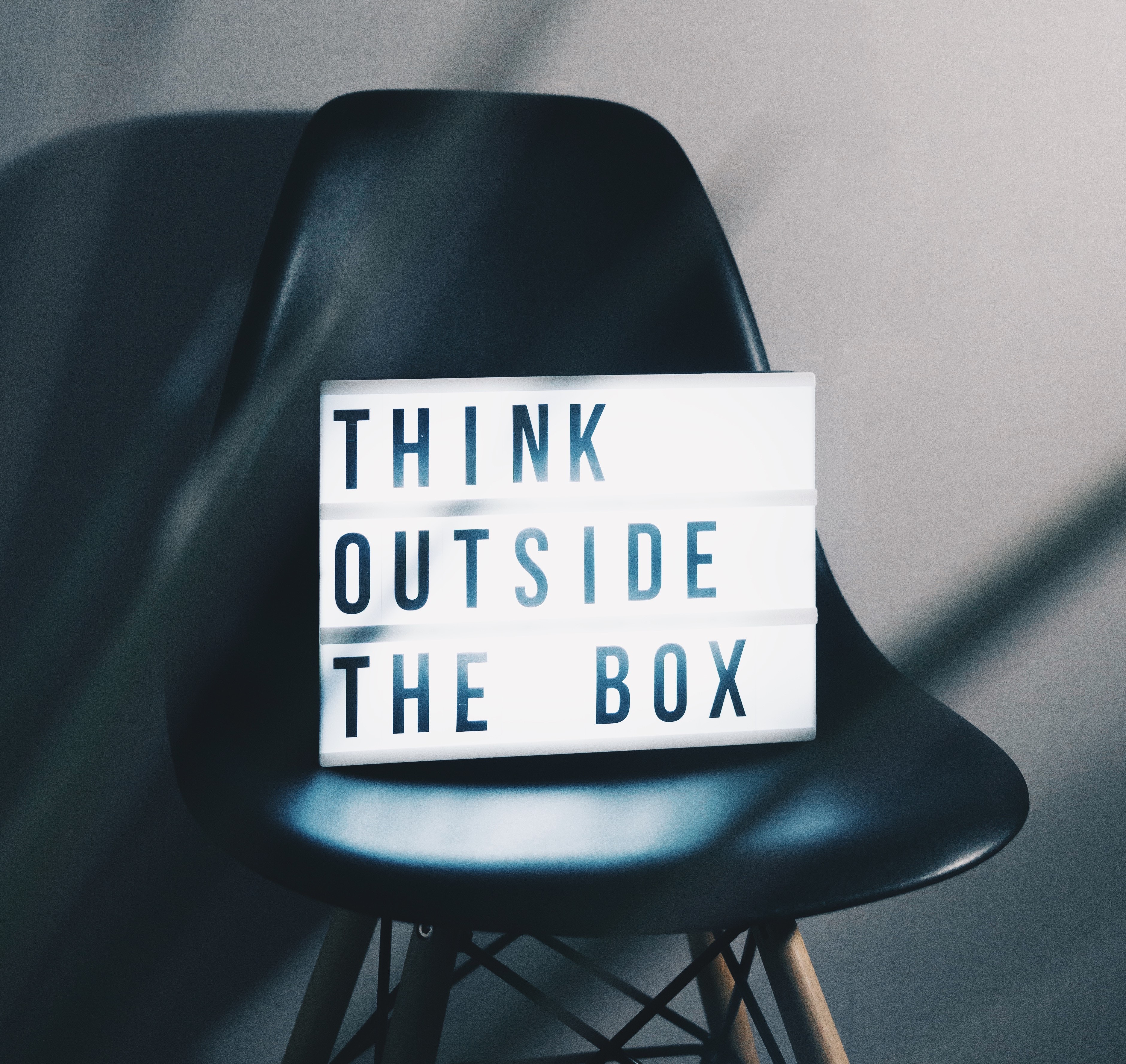 Lightbox on chair showing "Think outside the box"